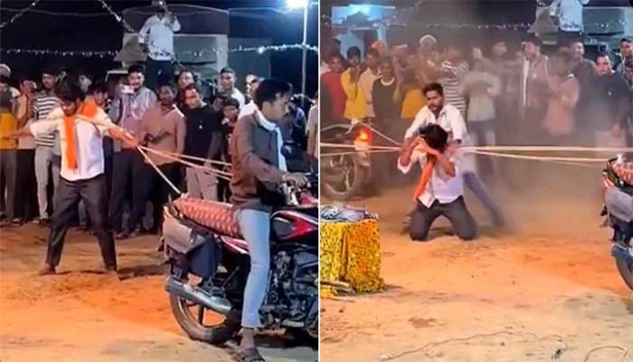 গলায় দড়ি পেঁচিয়ে চলন্ত বাইক টানার স্টান্ট! কয়েক সেকেন্ডের মধ্যেই মাটিতে লুটিয়ে পড়লেন তরুণ